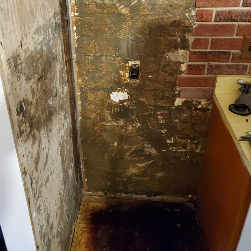 Unfortunate kitchen capers: behind my old fridge lurked thick layers of wall adhesive, while below it lurked the damage to the 1970s-era avocado flooring caused by old fridge cooking off the water it leaked. Writing Connections: DIY and Writing Part 2. Text and image by R. E. Gould